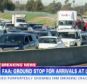 Traffic: Century Boulevard was closed leading up to LAX airport after reports of a shooting this morning. Desperate to catch their cancelled flights, many have been seen ditching their cars on the road and walking to the airport 