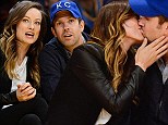 Caught kissing while courtside: Pregnant Olivia Wilde and Jason Sudeikis show their love at a Lakers game