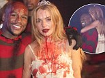 Hot property: Lindsay Lohan sneaks toyboy new squeeze into Halloween party but can't seem to get enough of engaged co-host Floyd Mayweather Jr