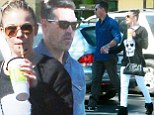 A show of unity: LeAnn Rimes holds hands with husband Eddie Cibiran as they head out for a healthy juice following impending split rumours 