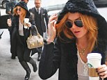 Lindsay Lohan goes braless in a sheer white top as she pops out for a mid-morning caffeine boost