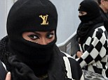 There's no disguising those peepers! Beyonce tries to sneak out of LA studio in burka-style head gear 