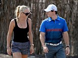 Back together: Tennis star Caroline Wozniacki and Rory McIlroy after the first round of the DP World Tour Championship
