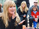 Heidi Klum's beau Martin Kristen bonds with her four-year-old daughter Lou as they cheer on Johan and Leni at soccer game 