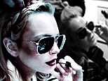 Shady behaviour! Lindsay Lohan gets glammed up for a shoot - but keeps her aviators on while getting her eyes made up