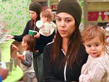 Fresh-faced Kourtney Kardashian dresses down in trackies as she takes children Mason and Penelope out for yoghurt