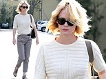 January Jones swaps her usual hipster style for much more mumsy garb as she heads out solo for lunch