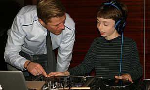 Hayden spins some discs under the supervision of the hotel DJ