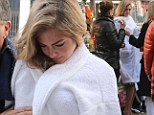 Hot diggity dog! Kate Upton disrobes in front of a fast food stand as she prepares to tuck into a cooked sausage during Mario Testino fashion shoot 