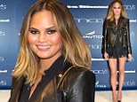 Forever legs! Model Chrissy Teigen struts her lean and long limbs in lacy black mini-skirt to attend fashion launch