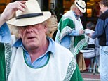 I TOLD you it was him! Nick Nolte gets stopped by fans, despite bizarre poncho and straw hat disguise