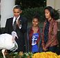'Be free': President Barack Obama, with daughters Sasha (3rd left) and Malia (right), pardons the 2012 National Thanksgiving Turkey, Cobbler. It died in August