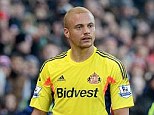 Perplexed:  Wes Brown received a red card for a challenge on Stoke City's Charlie Adam on Saturday