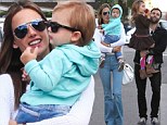 Alessandra Ambrosio flashes her toned midriff, besotted with her cute toddler Noah as he tries on dad Jamie Mazur's sunglasses during family excursion