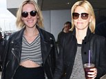 The Hunger Games - Catching Flight: Jena Malone and Elizabeth Banks on top of the world at airport as film set to top box office