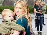 Doting mom Hilary Duff totes her lookalike son on her hip as she enjoys a family breakfast outing in Beverly Hills