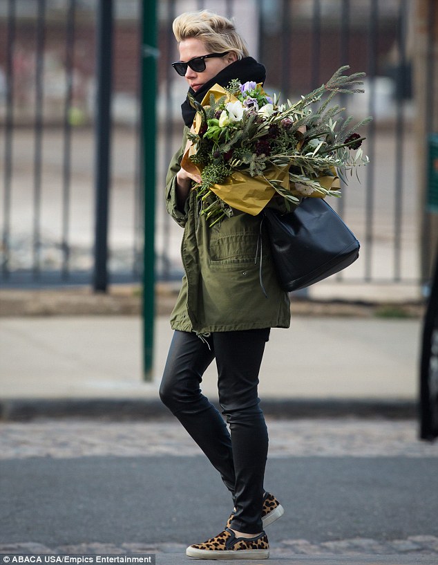 Braving the seasons: The 33-year-old actress took on the gusty winds of New York City to snag the flowers