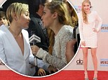 Miley Cyrus's big sister, Brandi, steals the show at the American Music Awards by stunning the crowd in a gorgeous white beaded dress 