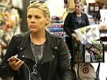 Rocker mom, not a soccer mom! Busy Philipps wears a leather motorcycle jacket and iPod while she grocery shops for Thanksgiving in Los Feliz