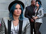 Demi Lovato embraces edgy look in glittery jacket, leather trousers and black hat over her bright blue hair 
