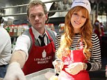 Neil Patrick Harris and Bella Thorne get their hands dirty as they serve up turkey to the homeless at LA Mission
