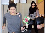 Shop 'til you drop: Kendall and Kylie Jenner coordinate in grey as they enjoy mall spree ahead of family Thanksgiving celebration