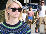 Reese Witherspoon gets in the festive spirit with a decidedly Christmassy sweater as she stocks up on Thanksgiving supplies with her family
