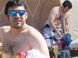 Well, they are the Wonder Years! Fred Savage makes the most of bonding time with his one-year-old son on Hawaii beach 