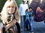 Well, that is certainly a lot of holiday spirit! A makeup-free Heidi Klum and her family pick out six Christmas trees, including a massive 12 foot fur
