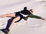 Cheeky beach: Ireland Baldwin asked her fans if she was making an angel in sand or snow on Saturday