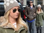 Attached at the arm! Ashley Tisdale shows off slim pins in very tight leggings on romantic stroll with fiance Christopher French