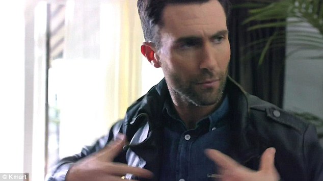 Jacket required: The Maroon 5 star pulls his jacket on - another item from the exclusive new range