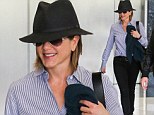 Fabulous at 44: Jennifer Aniston maintains her youthful glow with a trip to a skin care clinic before covering up from the harsh Californian sun