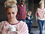 She's thinking pink...inside and out! While out with her boys, Britney Spears goes girlie by matching her trainers and poncho to her Pinkberry frozen snack