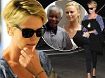 Sad homecoming: Charlize Theron jets back to her native South Africa ahead of Nelson Mandella's funeral