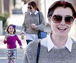 Knitty but nice! Alyson Hannigan wraps up in tasteful sweater as she goes for a stroll with daughter Satyana