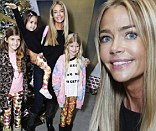 Christmas fun: Denise Richards put child abuse allegations behind her as she treated her daughters to a visit with Santa Claus at a fundraising event on Saturday in West Hollywood, California