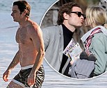 Liev Schrieber shows off his beach body as he takes a dip in the icy Pacific in tiny shorts... after kissing Naomi Watts on set of Pawn Sacrifice