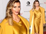 Sunny-side up! Kim Kardashian is overkill in a yellow coat and citrine satin dress as she attends Hollywood Reporter Annual Women in Entertainment Breakfast