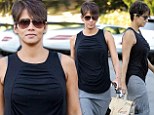 New mom Halle Berry is back to her Bond girl best as she shows off her trim figure in summery ensemble less than 10 weeks after giving birth