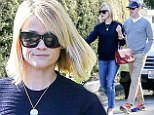 Post holiday blues! Reese Witherspoon shows how to do casual chic in denim and navy as she and husband Jim Toth adjust to life after their Paris getaway