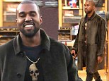 The smile that shows he has found Kim's perfect present! Kanye West breaks out into a rare grin after shopping at Chanel 