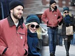 Wrapped up in love! Dakota Fanning braves the cold with much older boyfriend Jamie Strachan on the streets of New York