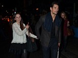 Mystery: Catwalk star David and a female friend leaving The Groucho Club in London's Soho
