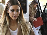 Is she trying to beat Kanye West with the best present? Kim Kardashian embarks on a serious Christmas shopping trip 