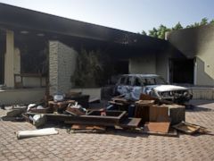 PHOTO: A burnt vehicle and broken furniture lay inside the US consulate compound in Benghazi, Sept. 13, 2012, following an attack on the building.