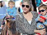 Indulging in horseplay! Selma Blair takes son Arthur for a pony ride and Santa visit at the farmers market