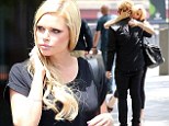 Who's the mystery man? Australian star Sophie Monk gets amorous in the street with an unknown blonde