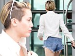 All that twerking's paying off! Miley Cyrus reveals pert posterior and toned legs in tiny Daisy Dukes
