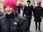 Cosy: Amanda Seyfried enjoys a romantic walk with boyfriend